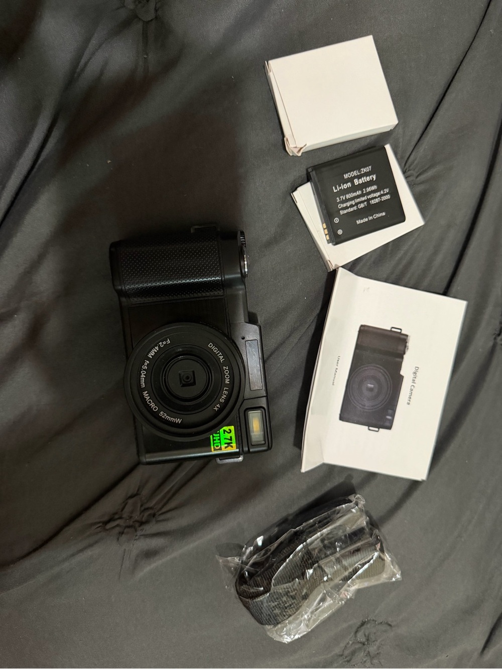 Compact Black Digital Camera with Accessories